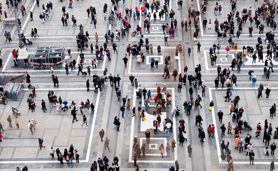 People walking in a public square.