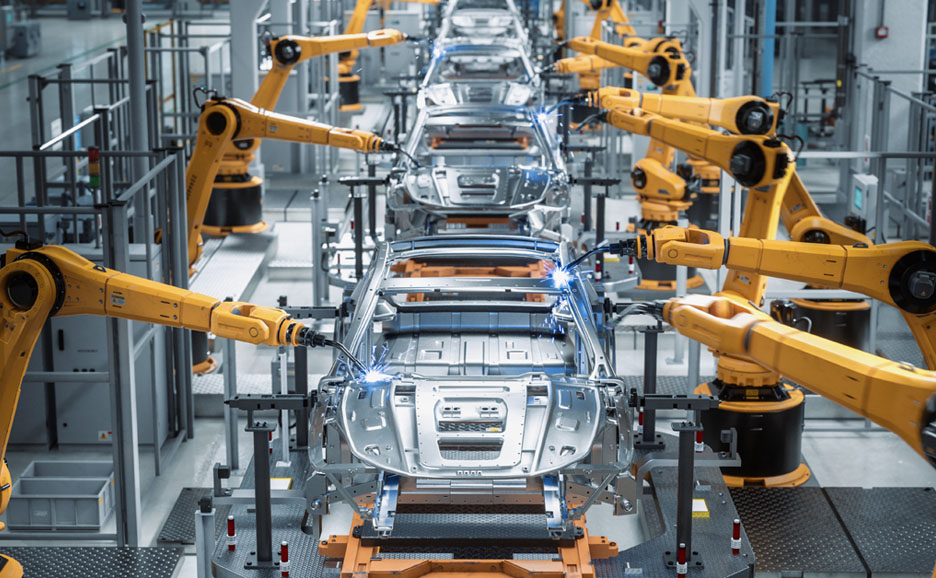 Automated robot arm assembly line manufacturing high-tech cars in factory