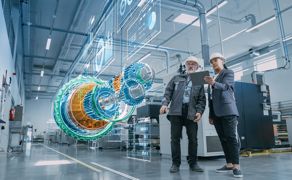 Two engineers looking at a virtual 3D model of an engine in a factory