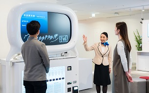 Image of an attendant guiding a customer